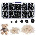 Amigurumi safety eyes set in multiple sizes 6mm 8mm 10mm 12mm 14mm Black plastic safety eyes for crochet toys with secure backing Close-up of glossy toy eyes installed on handmade doll Safety eyes for plush toys and amigurumi animals.