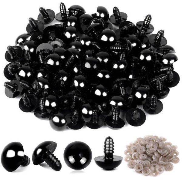 Black plastic safety eyes for crochet toys with secure backing Close-up of glossy toy eyes installed on handmade doll Safety eyes for plush toys and amigurumi animals
